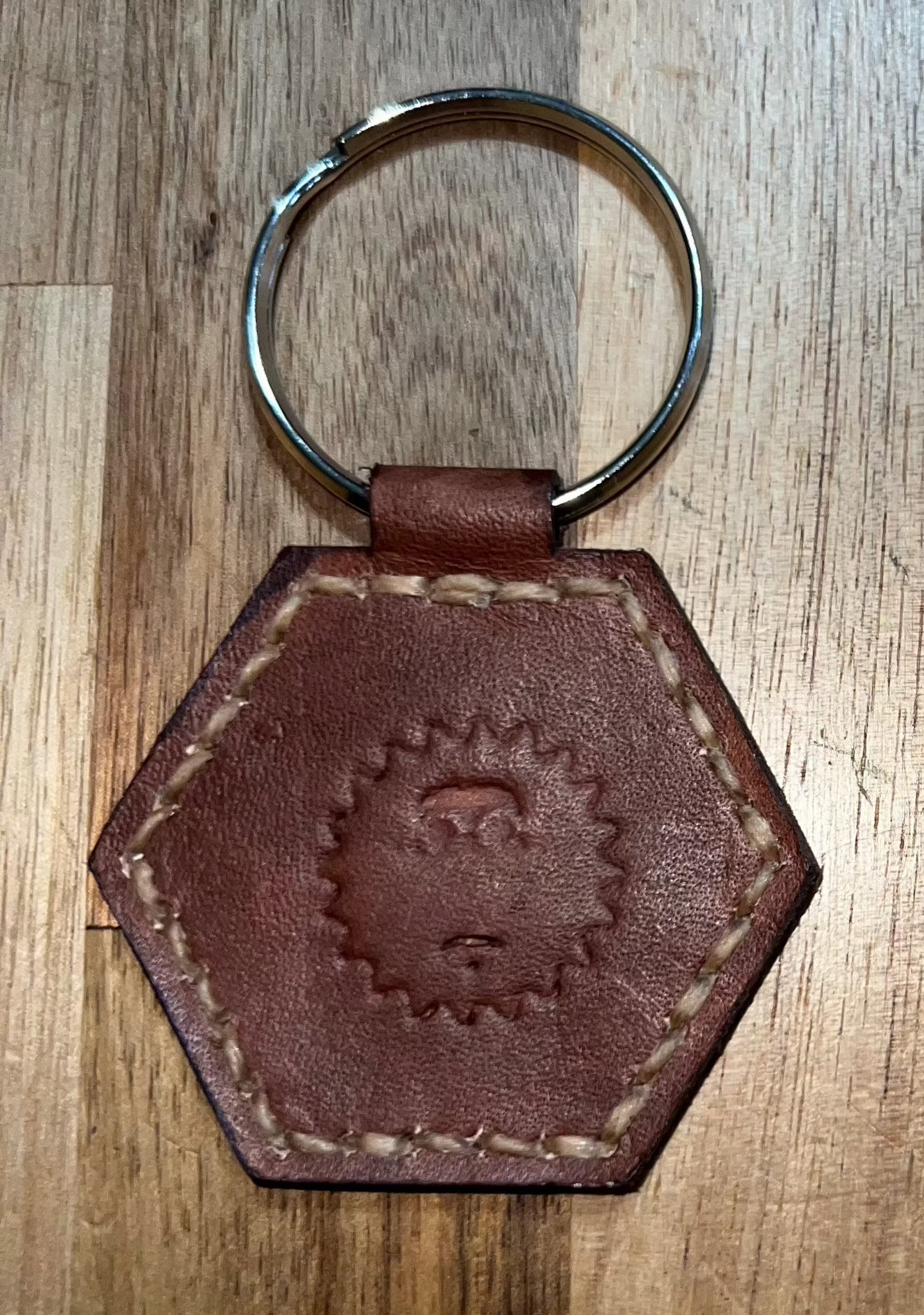 Coin keychain hexagon brown