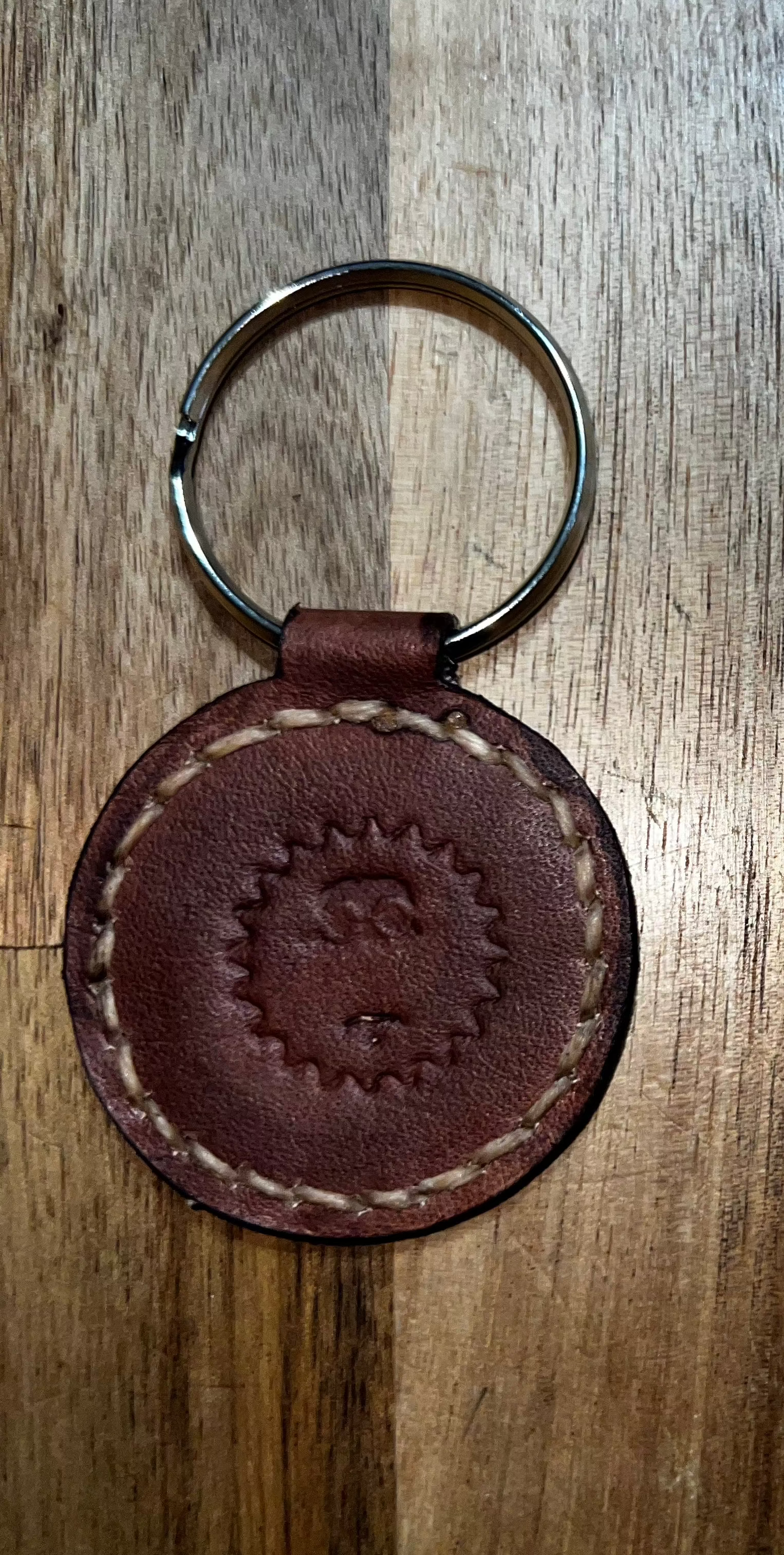 Coin keychain round brown